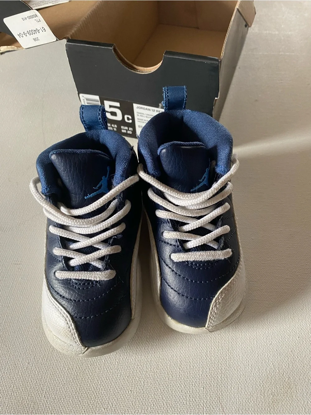 Nike Kids Navy and White Jordan 12’s